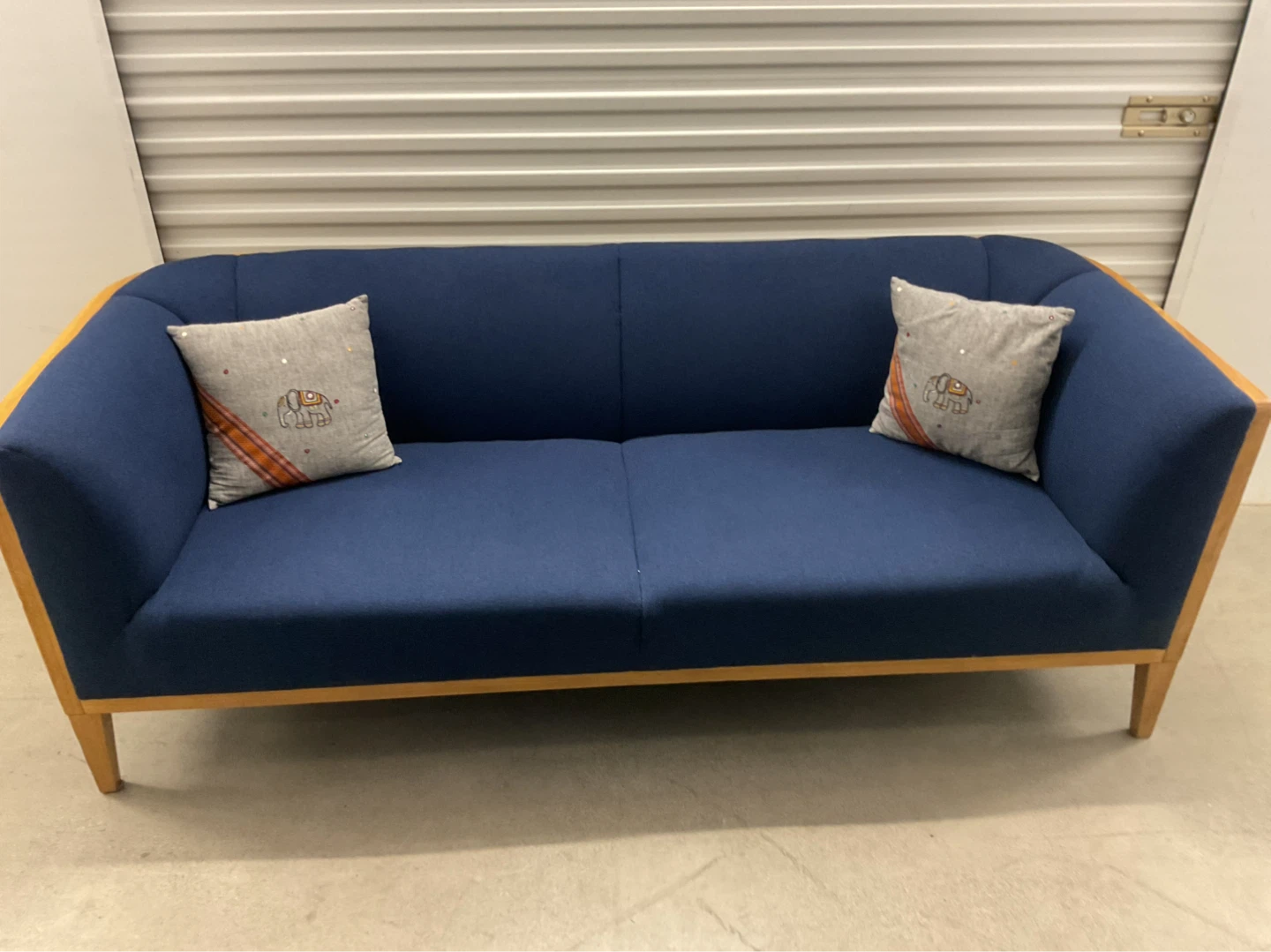 Blue Upholstered Sofa with Cane Back and Wood Frame