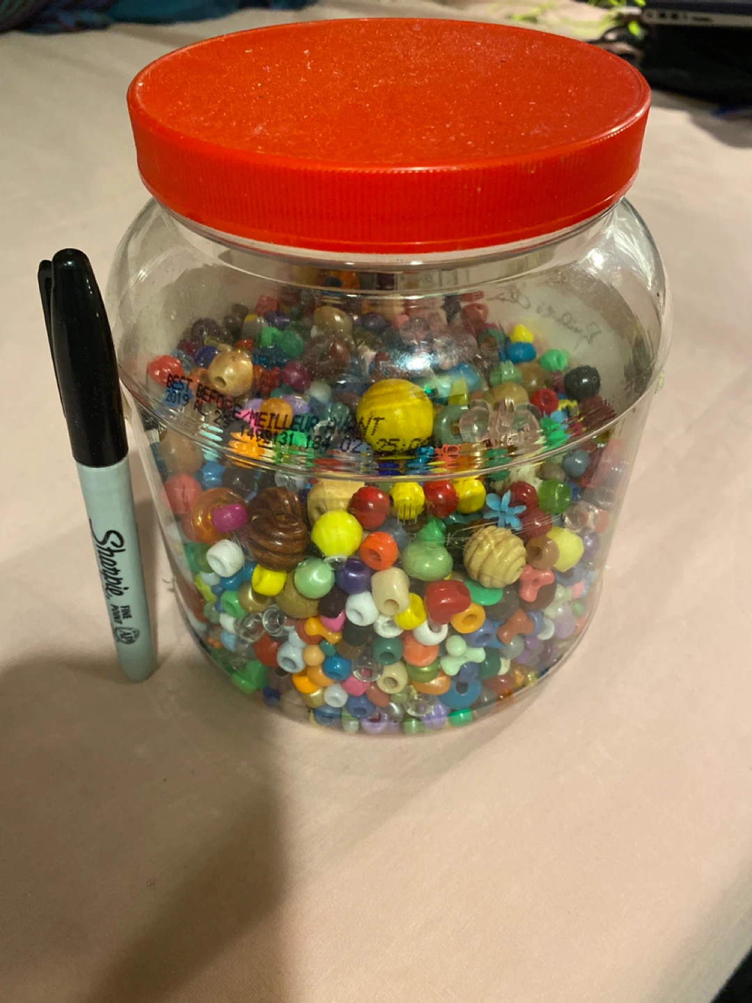 Jar of assorted craft beads
