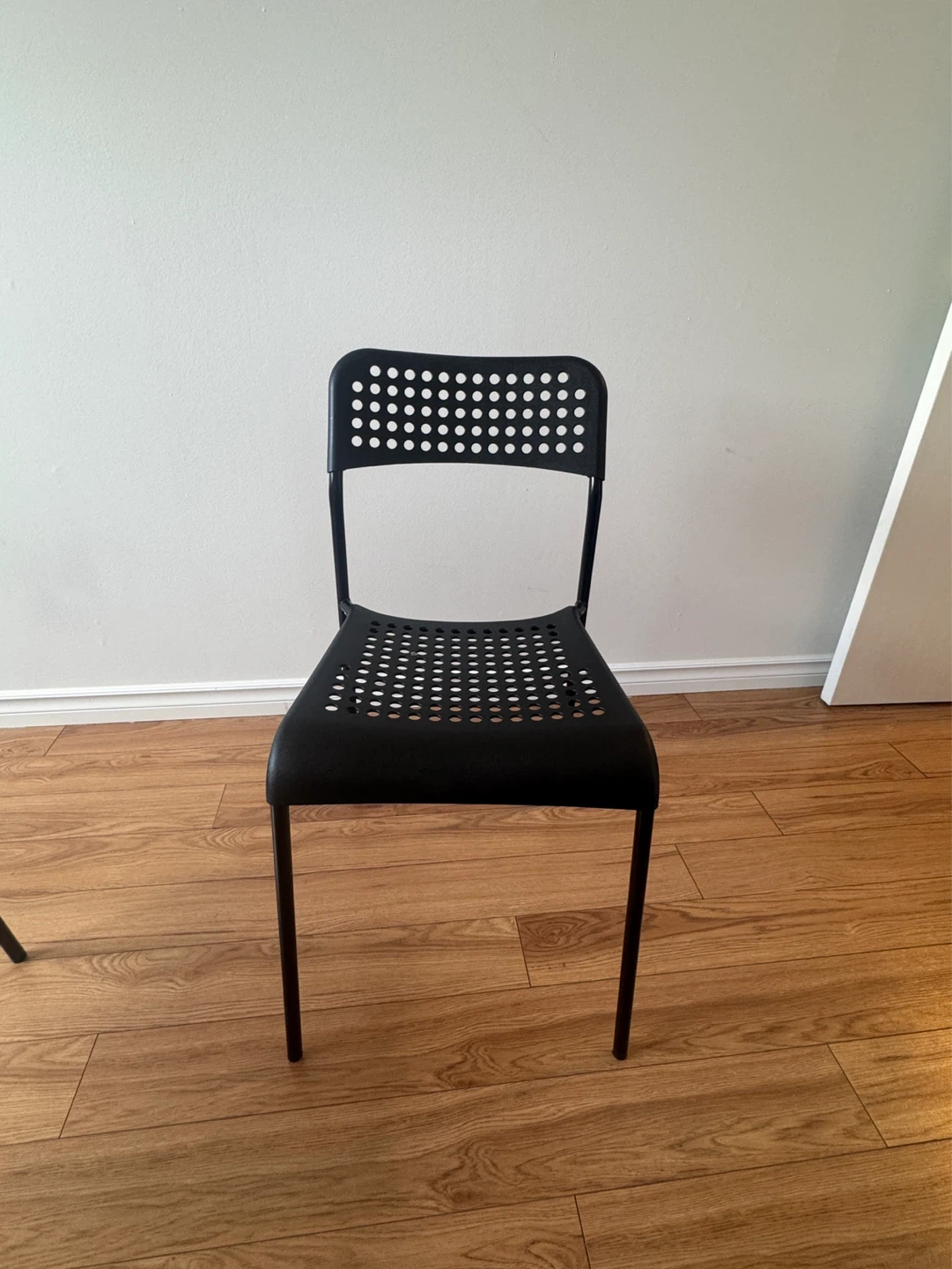 Black Stacking Chair with Perforated Seat and Back