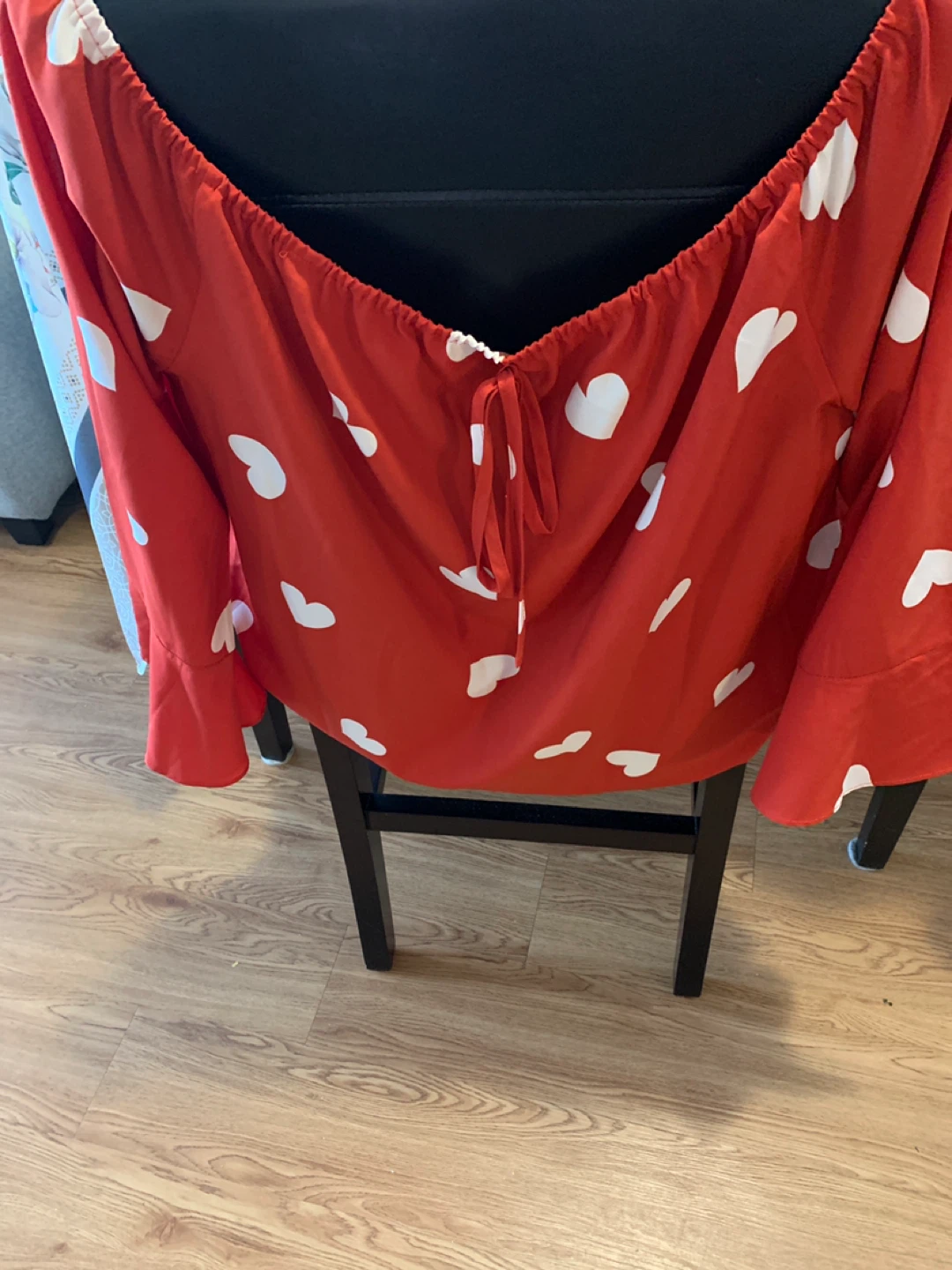 Red long sleeve top with white hearts