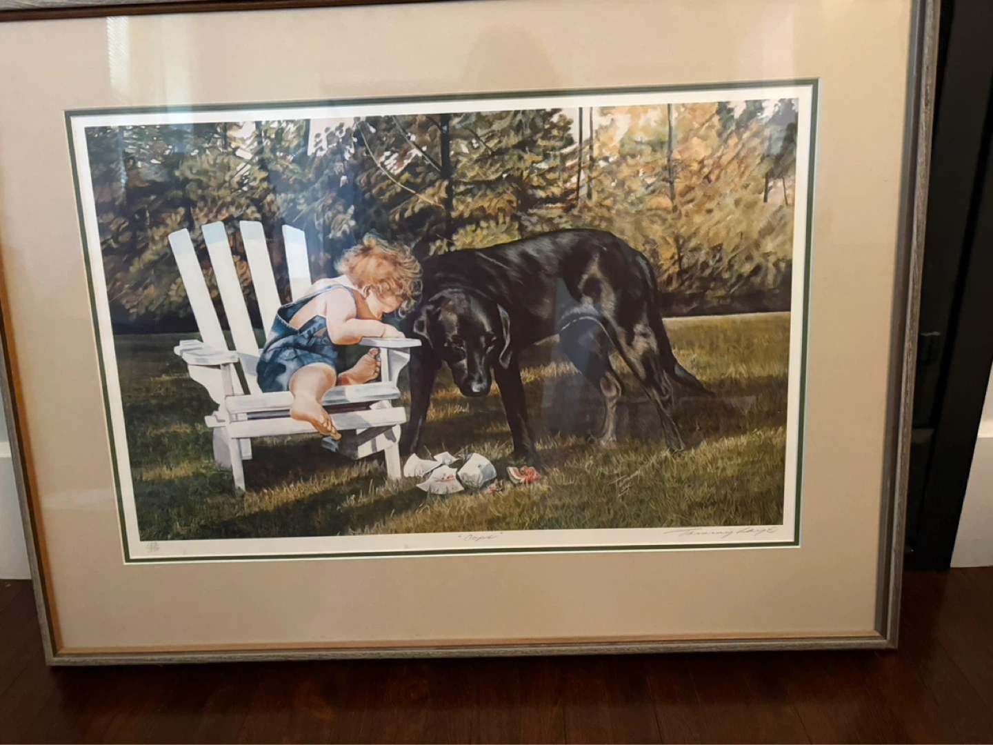 Framed Print of Child and Black Lab