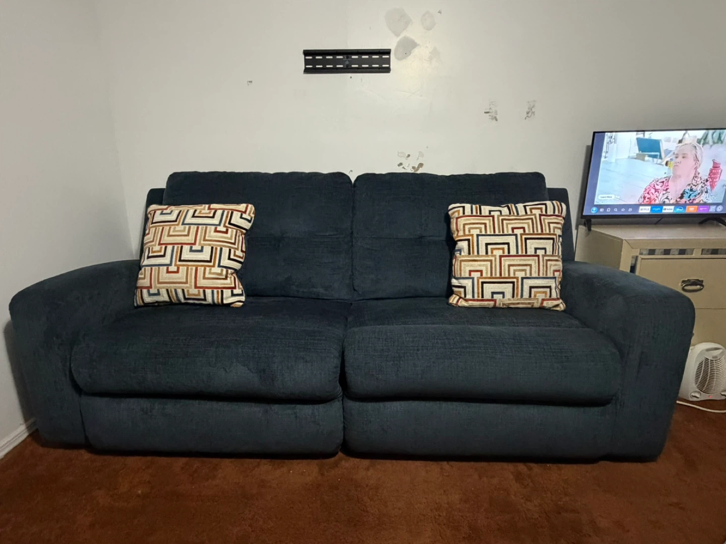 Dark Blue Upholstered Sofa with Decorative Pillows