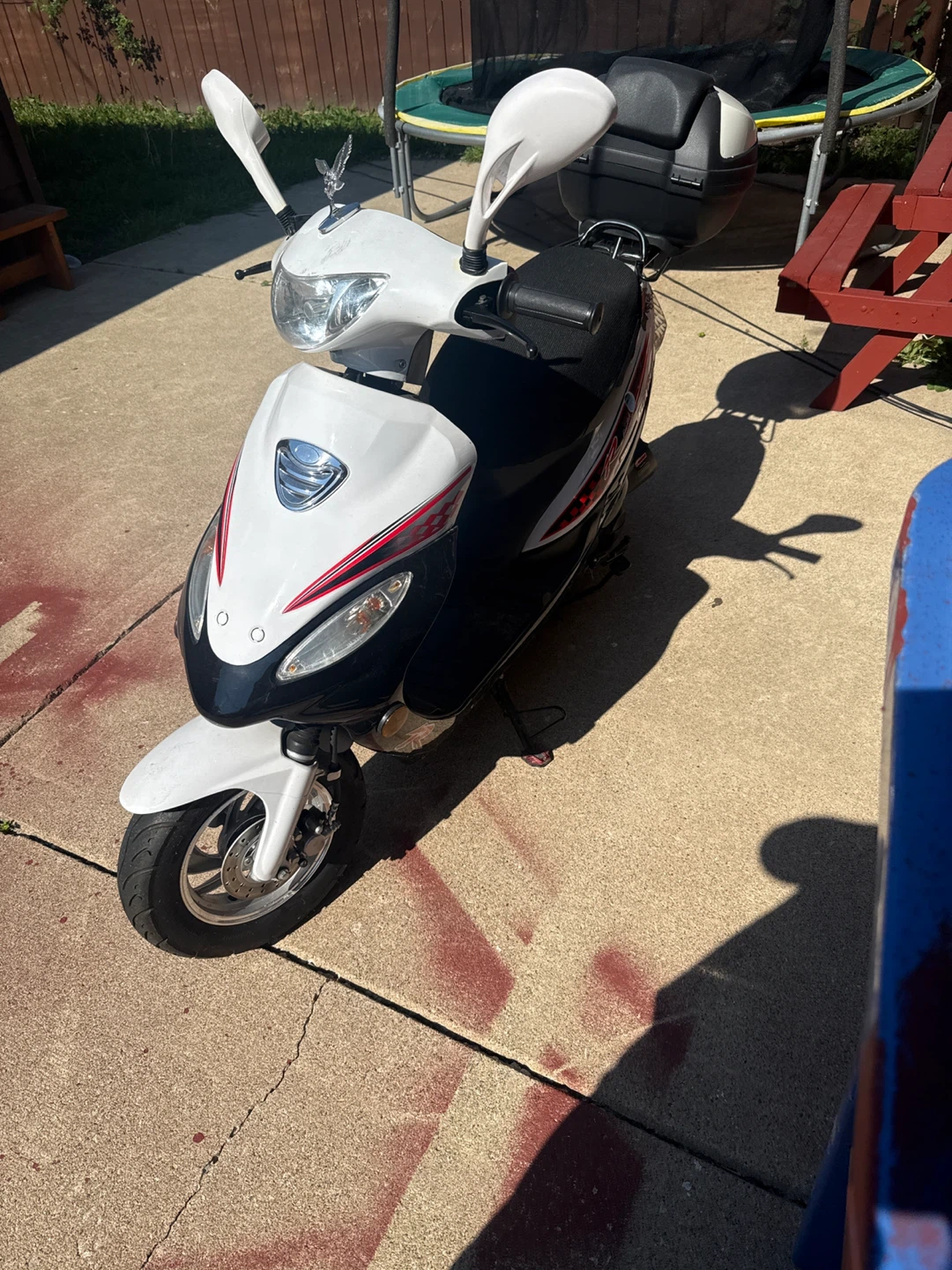White and Black Scooter with Top Case