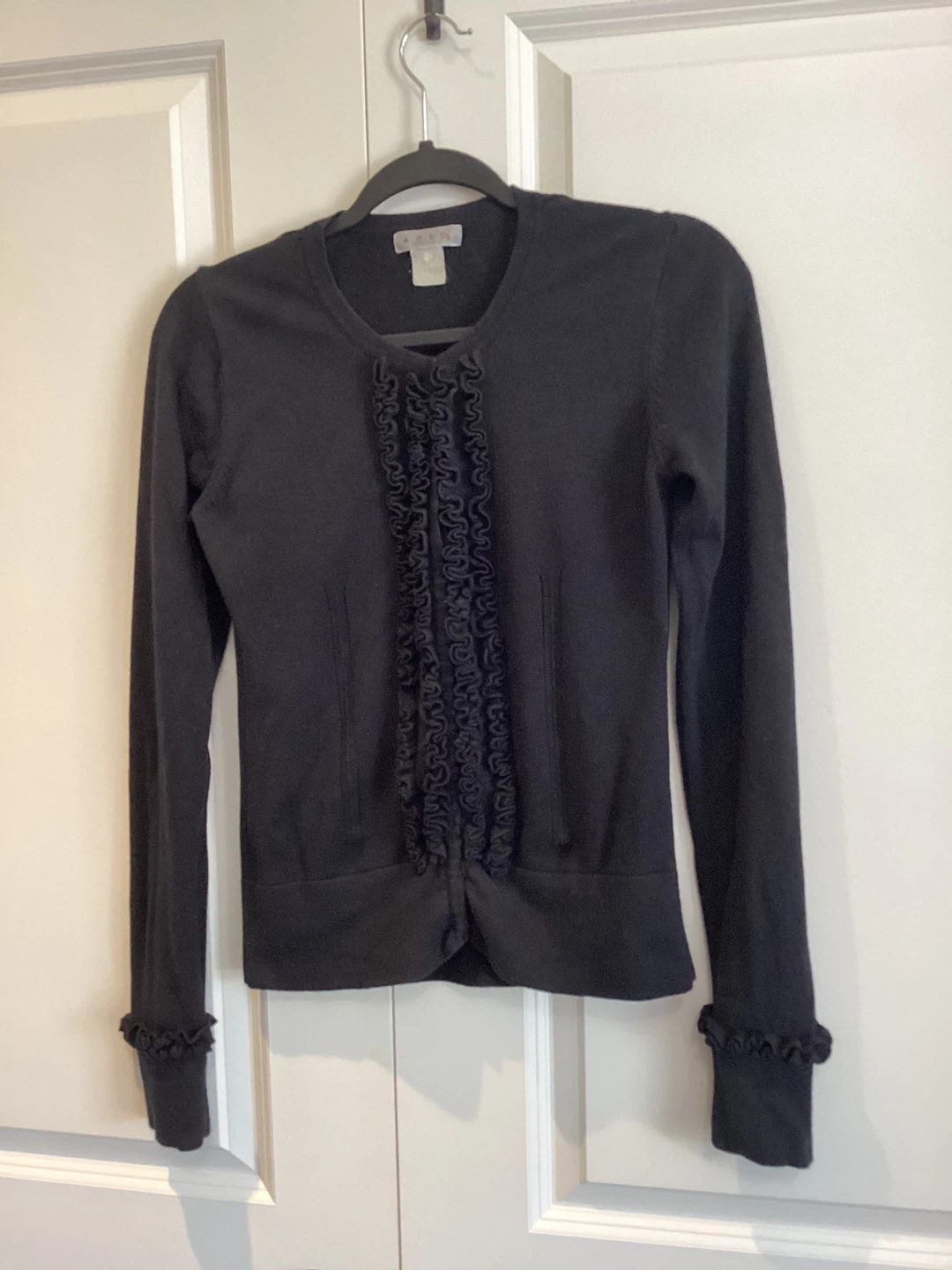 BLACK SWEATER WITH UNIQUE RUFFLE DETAIL