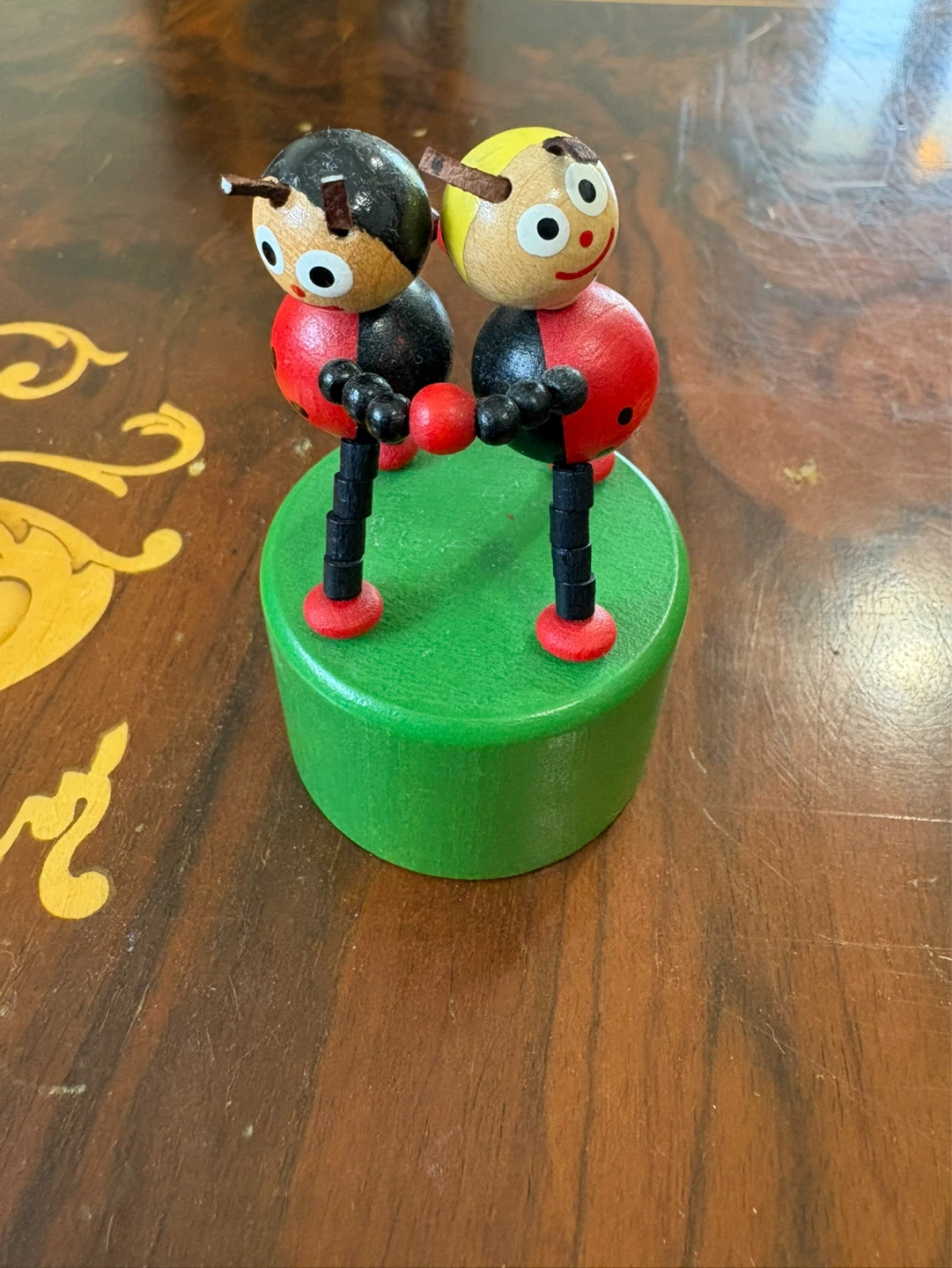 Vintage ladybug wooden push puppet