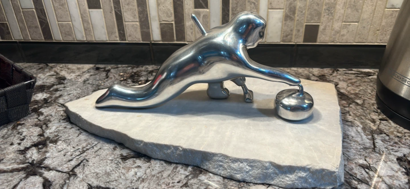 Curling Player Sculpture on Stone Base