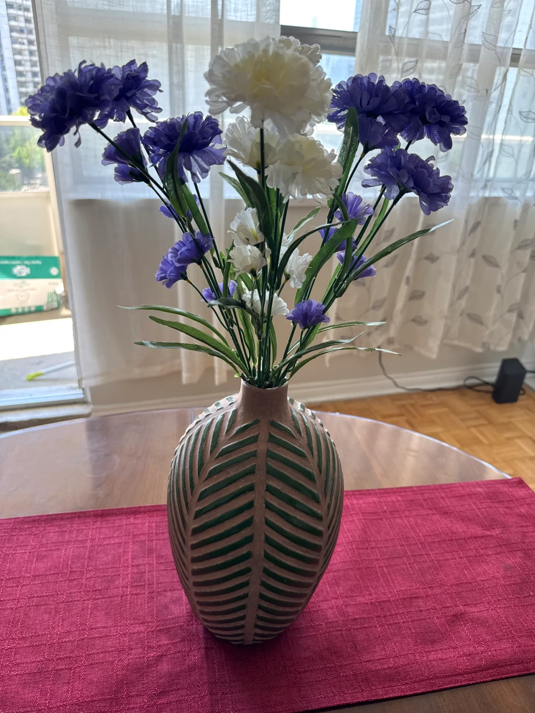Leaf pattern clay vase with artificial flowers