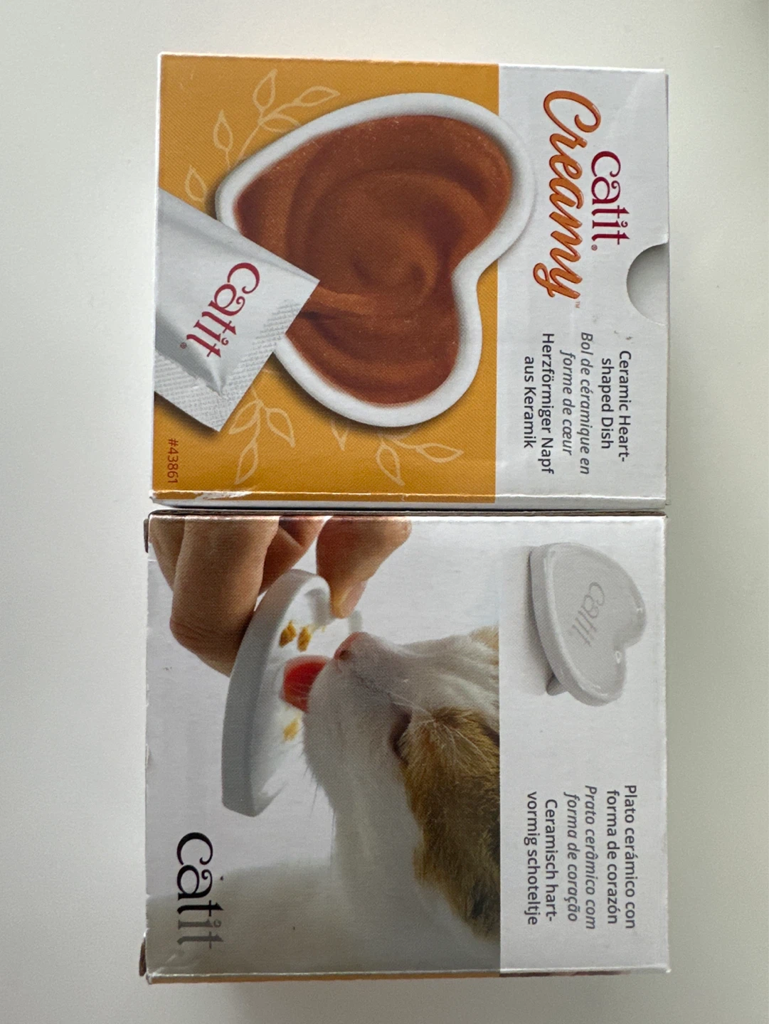 A pair of Catit Creamy Ceramic Heart-Shaped Dish
