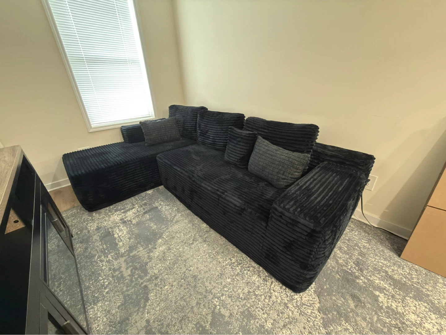 Black Sectional Couch with Striped Fabric