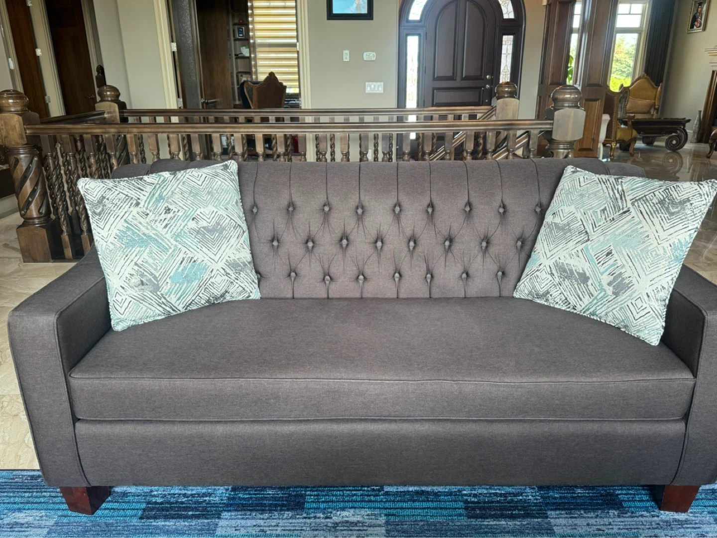 Dark Grey Tufted Sofa with Decorative Pillows