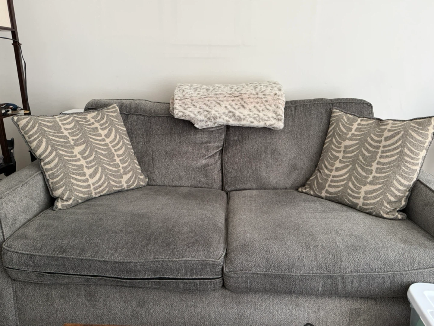 Gray Sofa with Decorative Pillows and blanket - photo 3