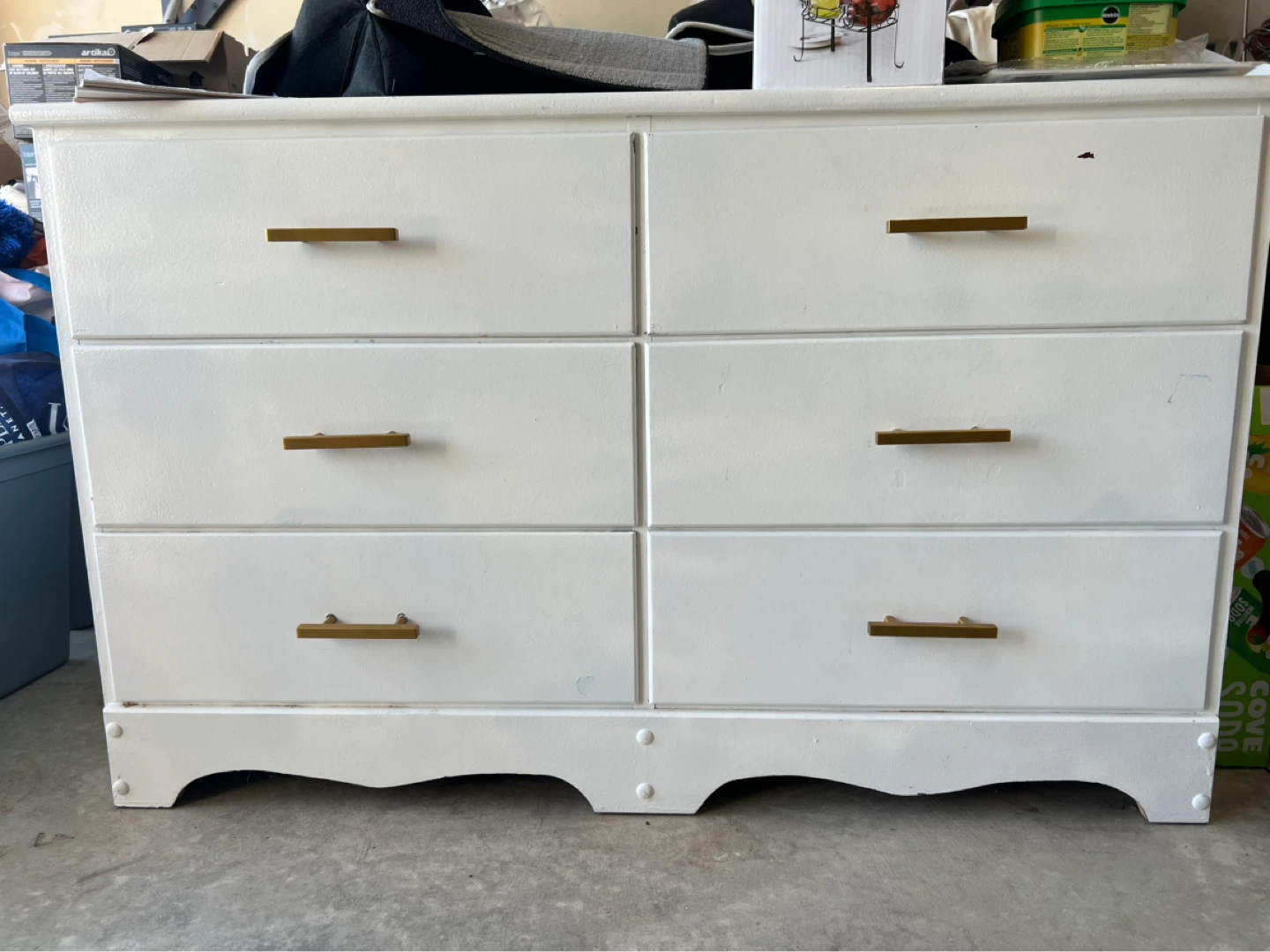 White six-drawer dresser with gold handles