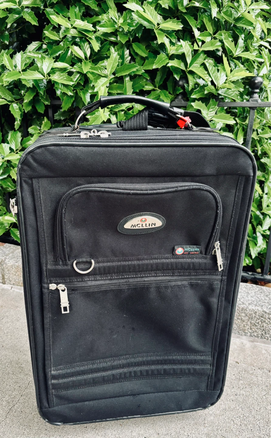 McLin Black Canvas Rolling Carry-on Suitcase
