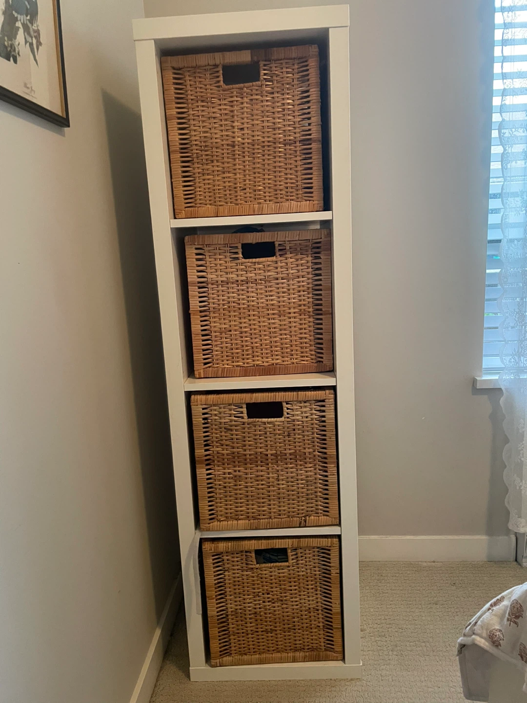 White shelving unit with wicker baskets