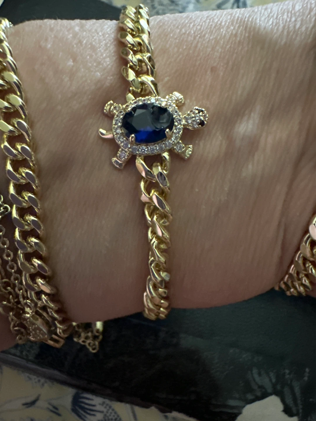 Gold tone necklace with tuetle pendant