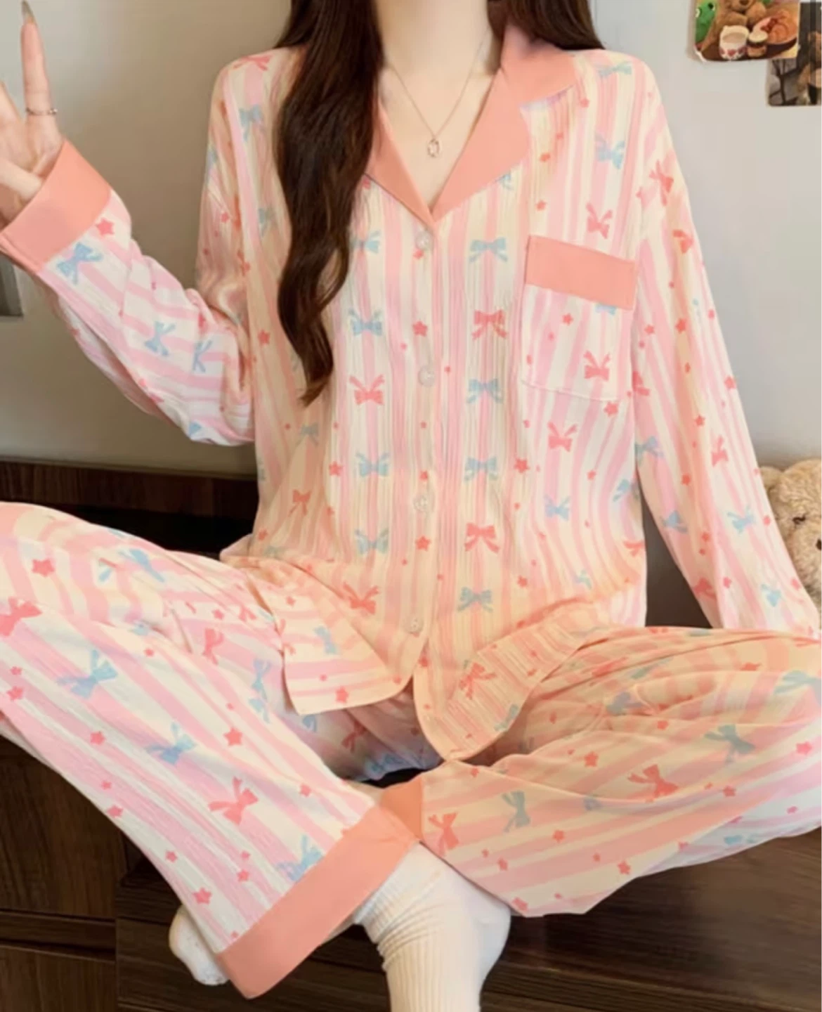 Pink striped pajama set with bows and stars