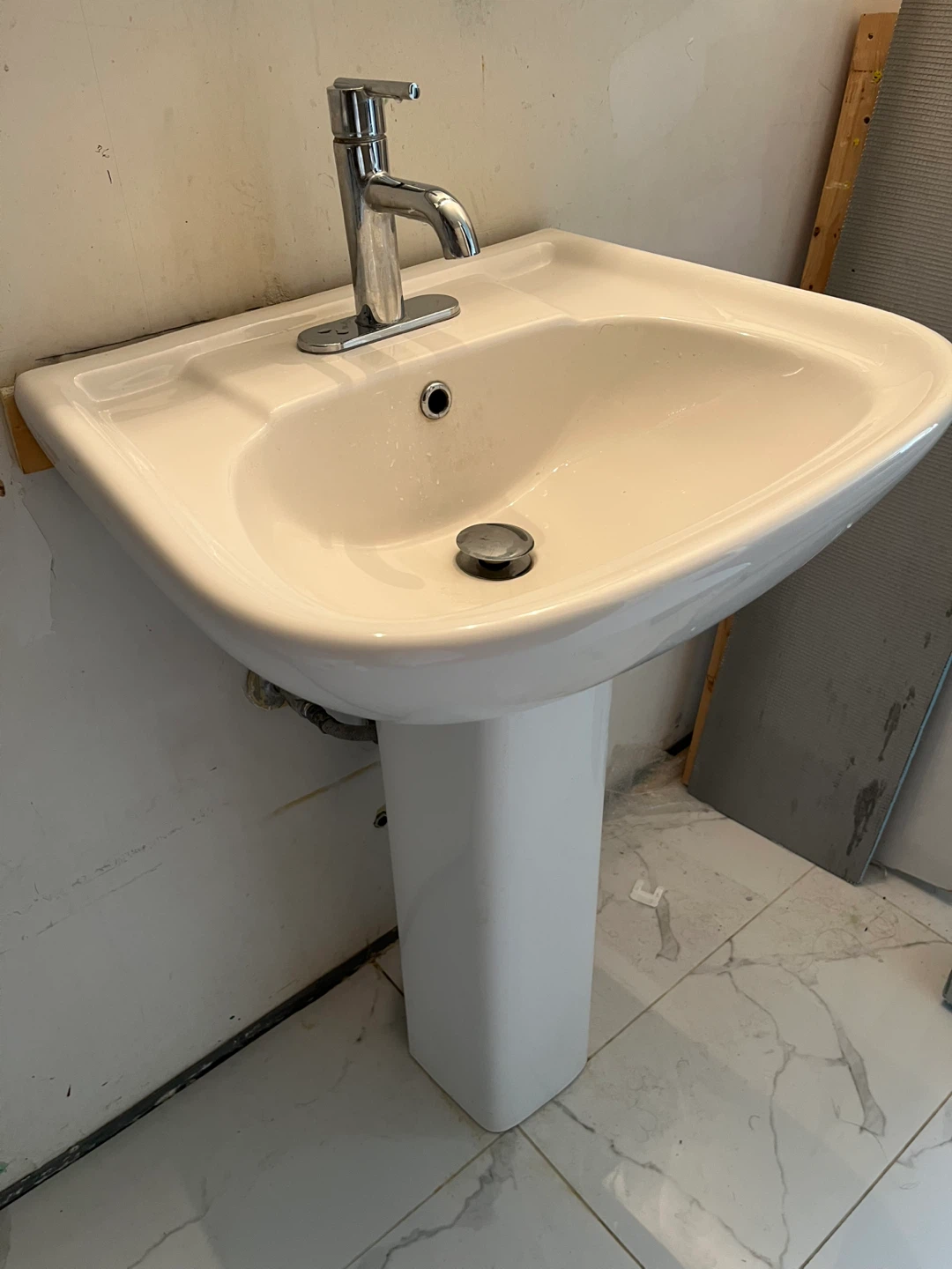 White Pedestal Sink with Chrome Faucet