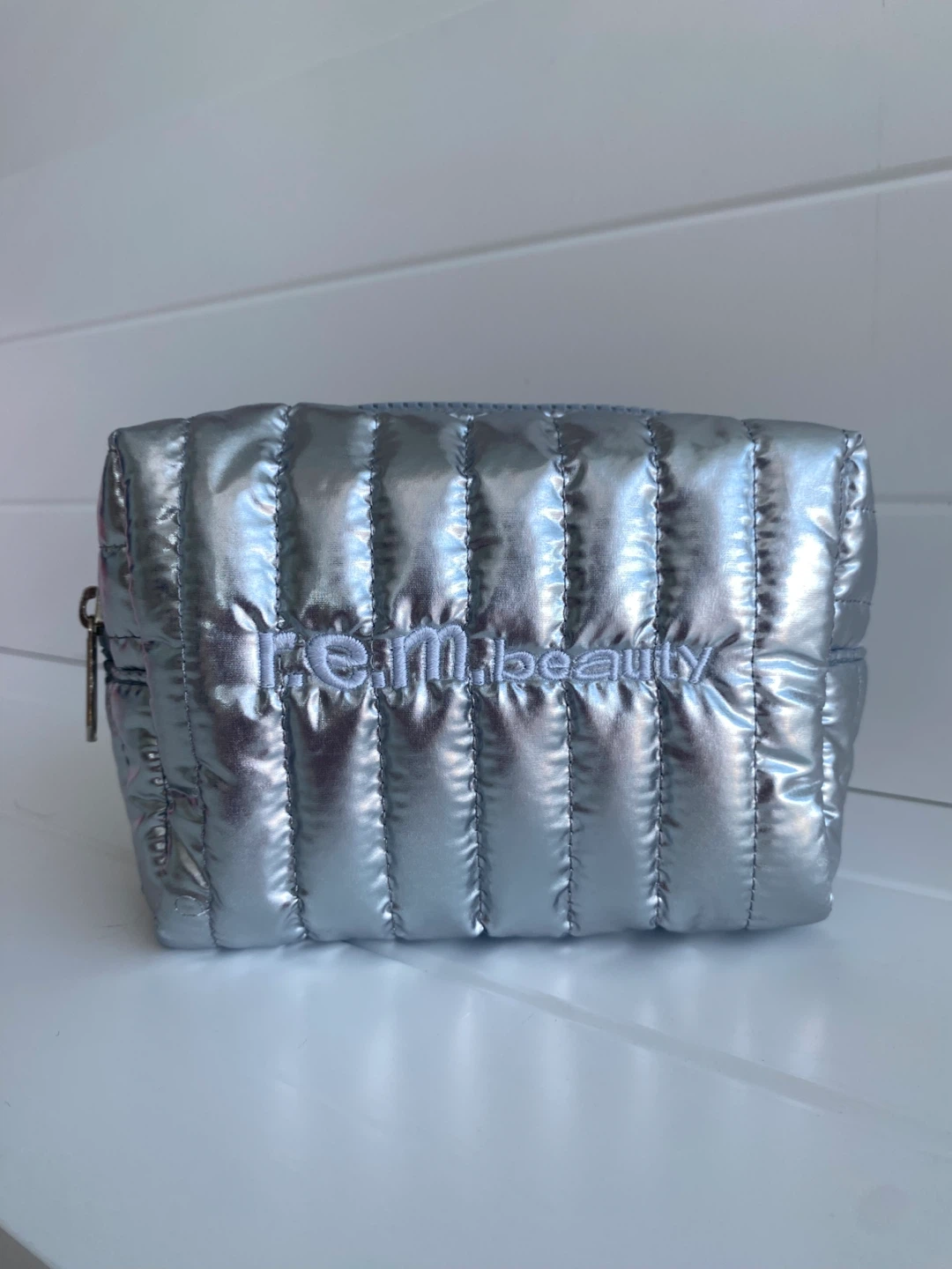 r.e.m. Beauty anniversary silver makeup bag