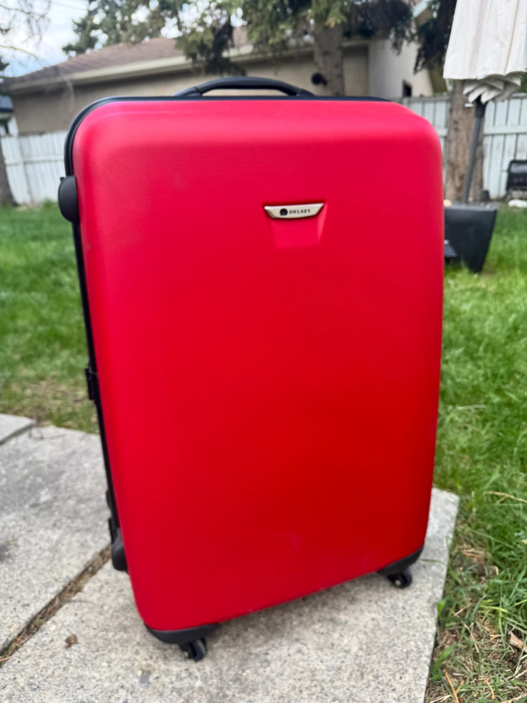 Red Delsey Hardside Suitcase brand new