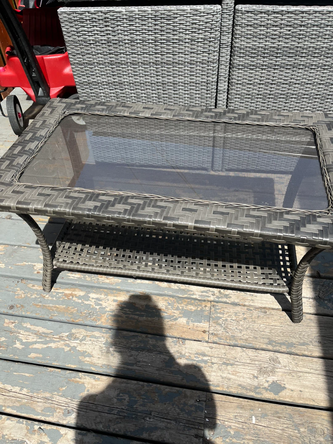 Wicker patio coffee table with glass top