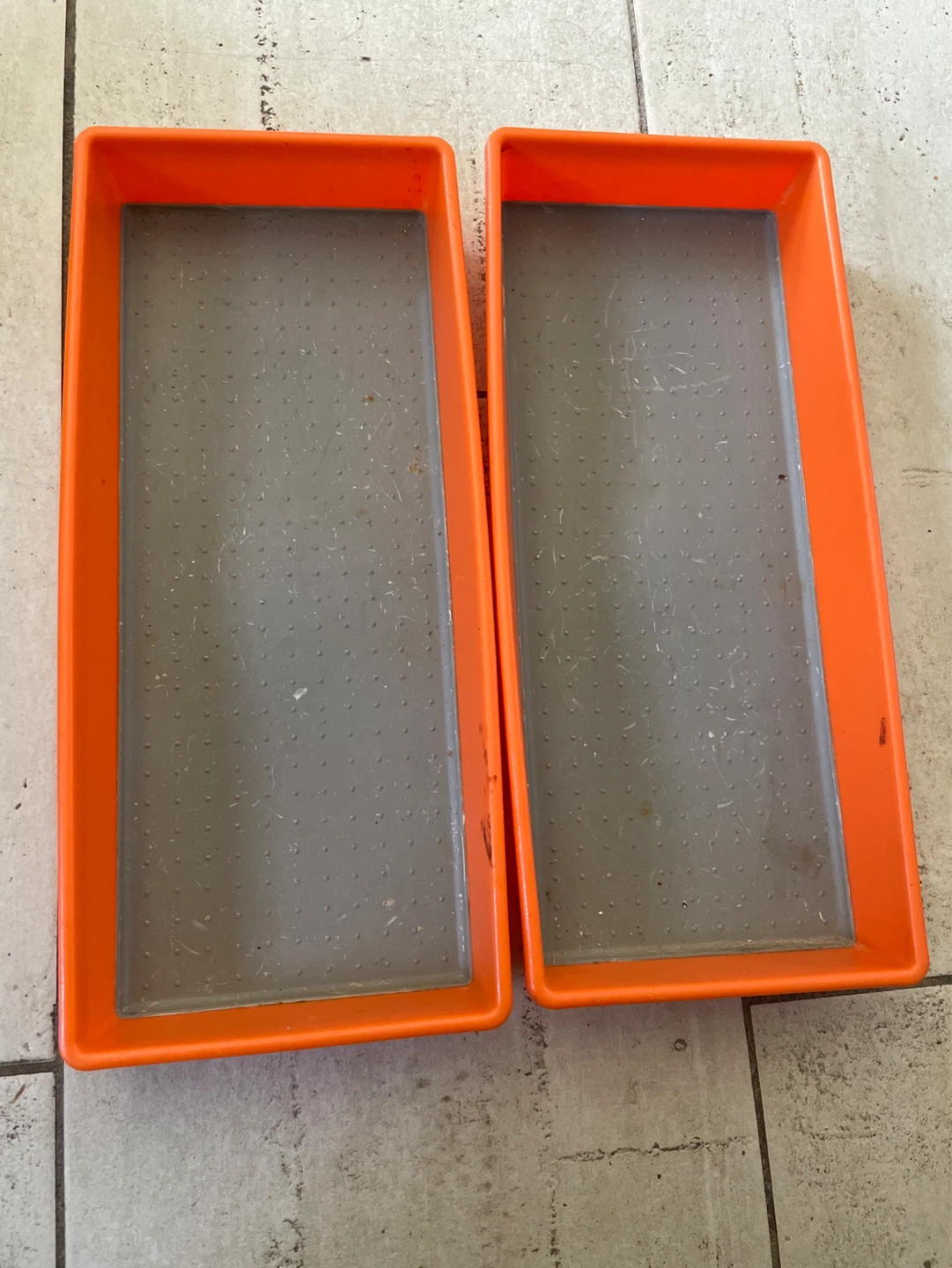 Two Orange and Grey Plastic Trays