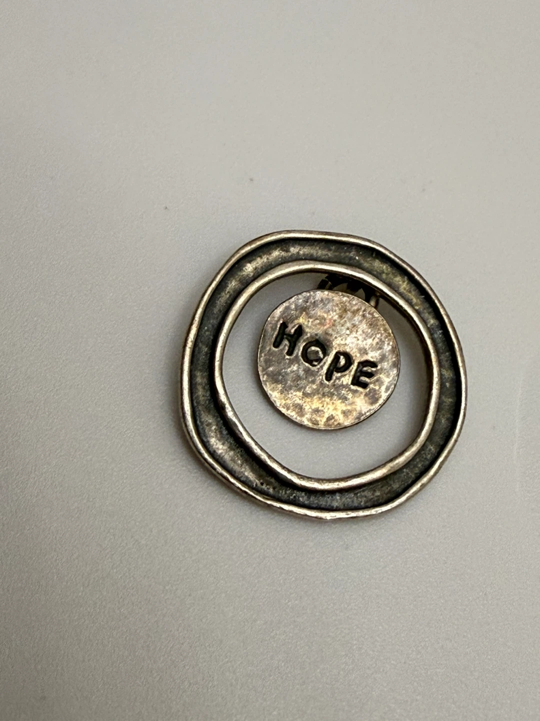 Pendant with "HOPE" engraving
