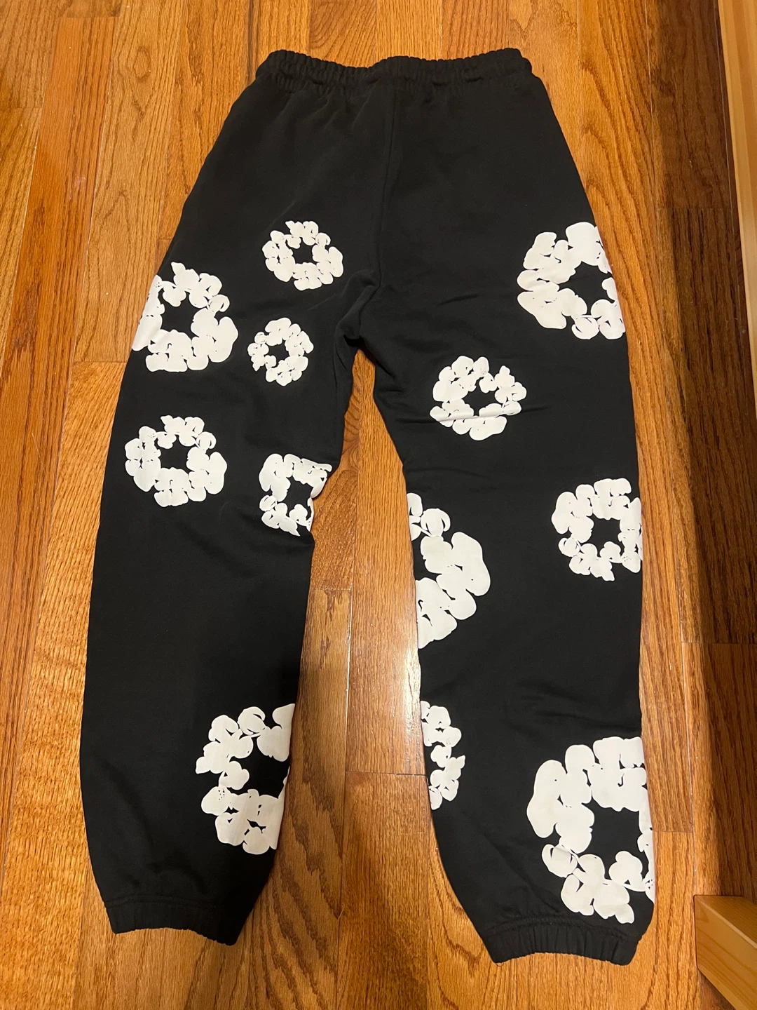 Denim Tears Black Sweatpants with White Floral Print - photo 2