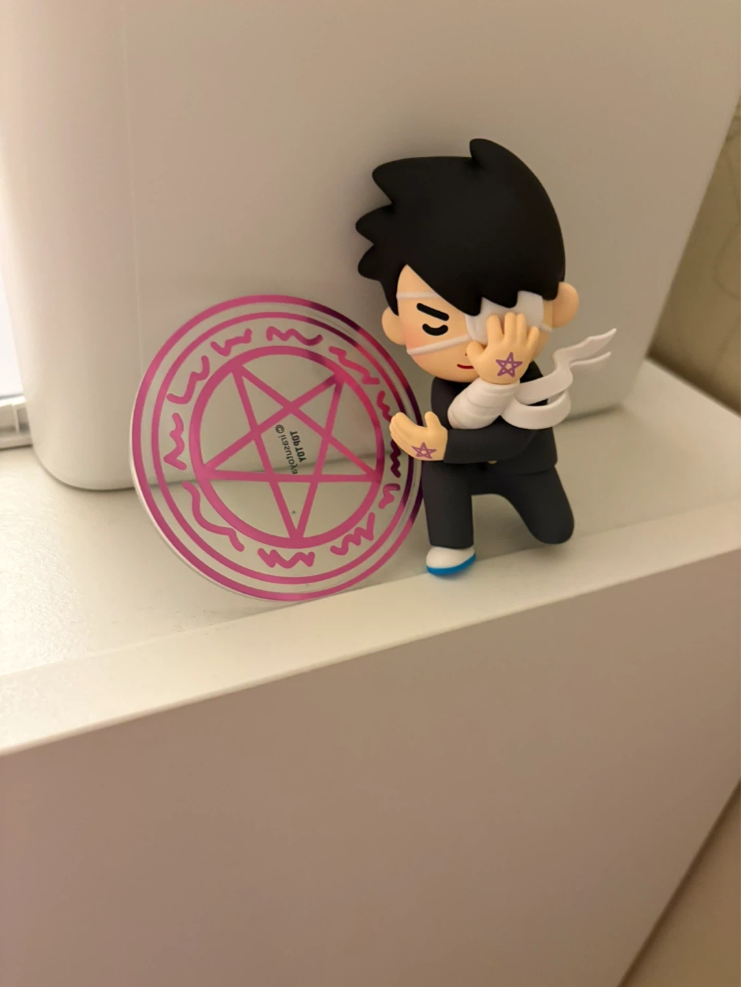 Ninja figurine with purple star designs