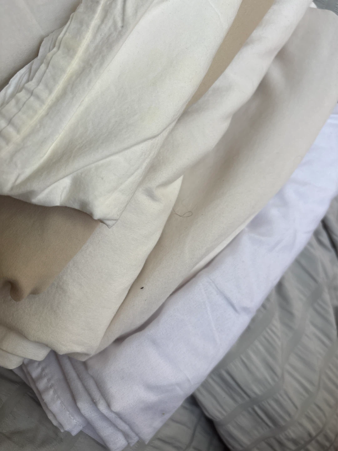 Stack of White and Cream Linens