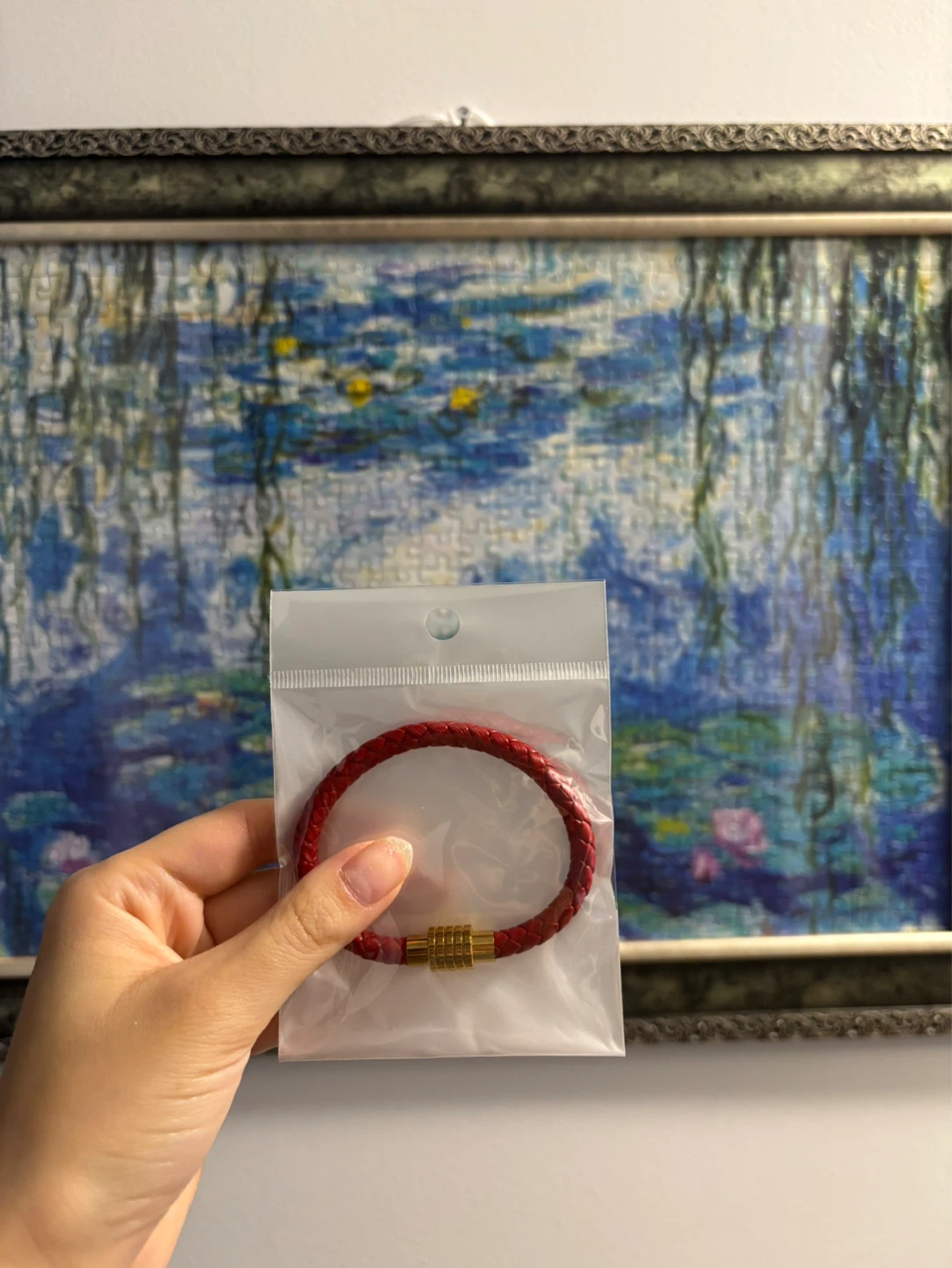 Red braided leather bracelet with gold clasp