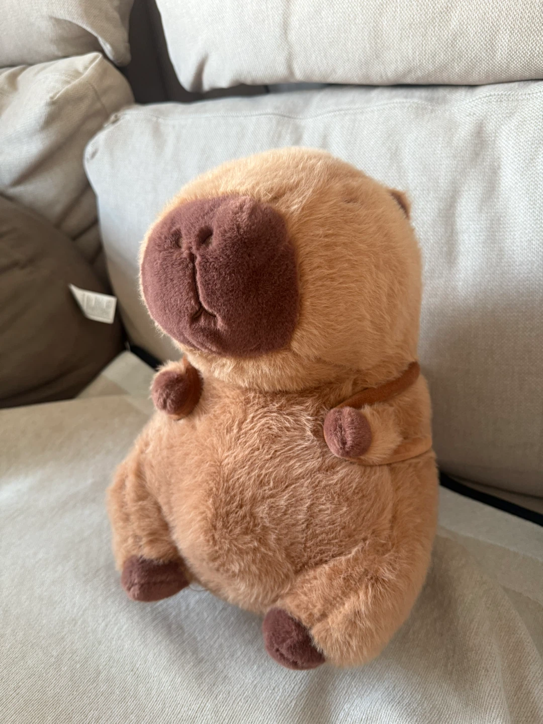 Capybara plush with hamburger accessory