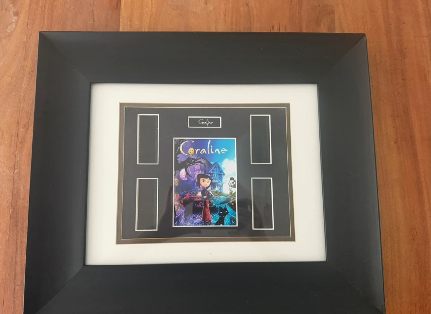 Framed Coraline Movie Poster with Film Cells
