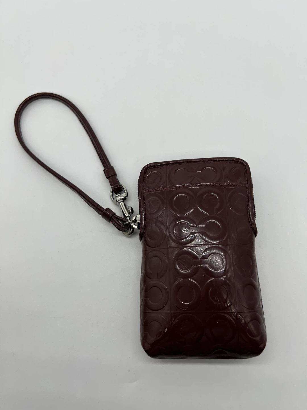 Coach Plum Embossed Wristlet