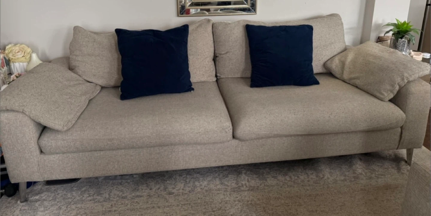 Light Beige Loveseat Sofa with Navy Accent Pillows