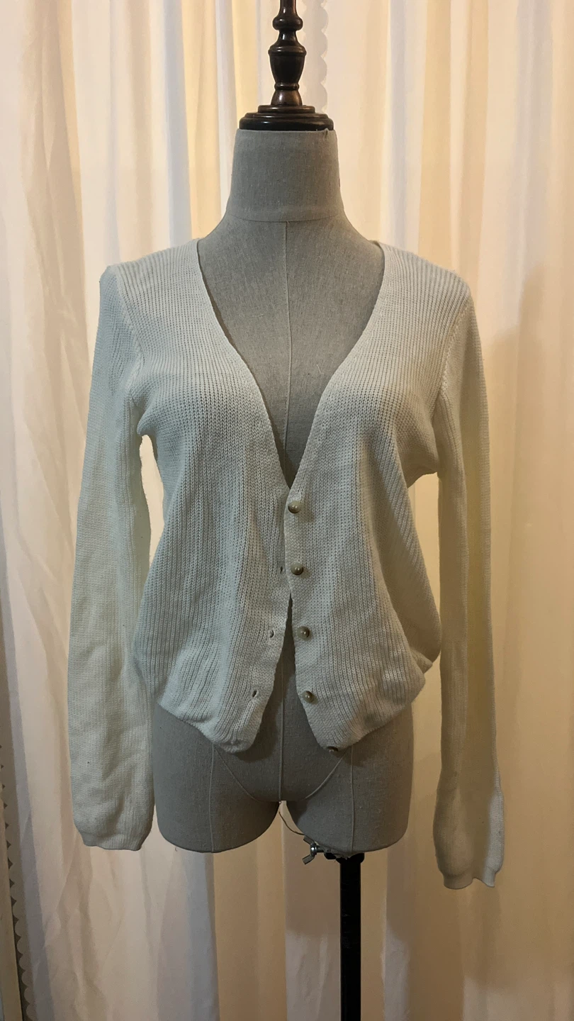 Cream coloured button-up cardigan