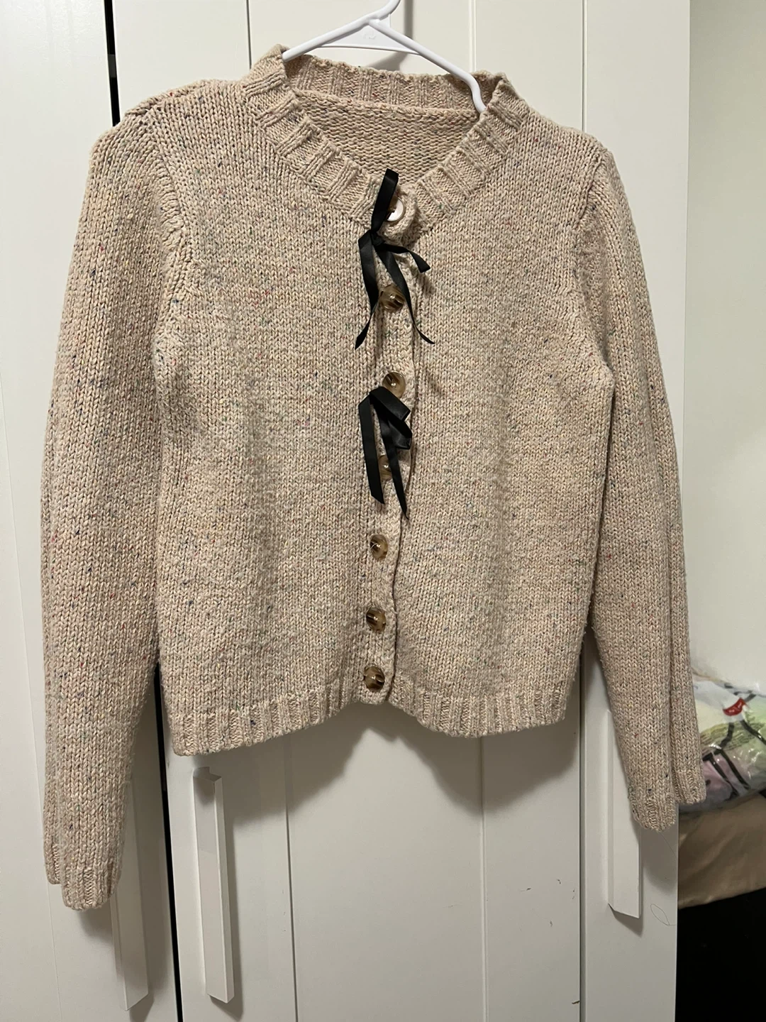 Cream knit cardigan with black ribbon detail