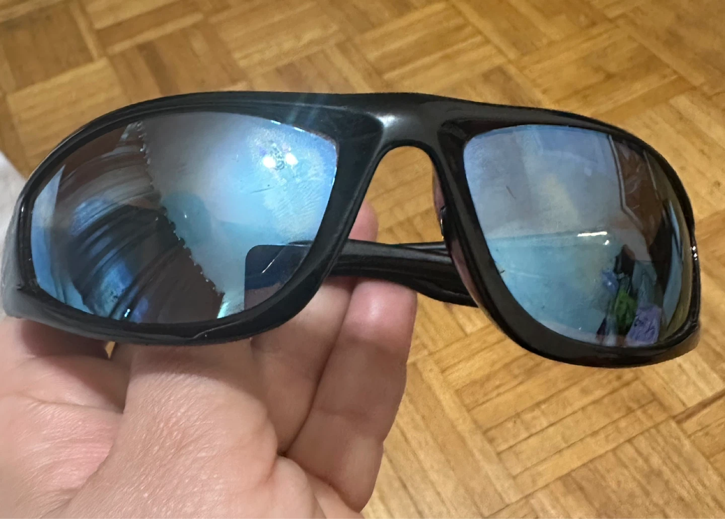 Black sport sunglasses with blue mirrored lenses