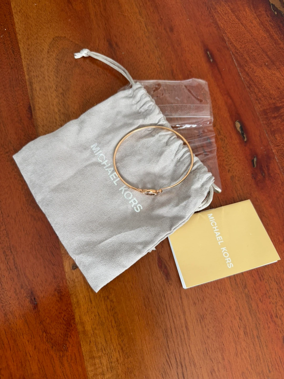 Michael Kors Gold Tone Bangle Bracelet with MK Logo
