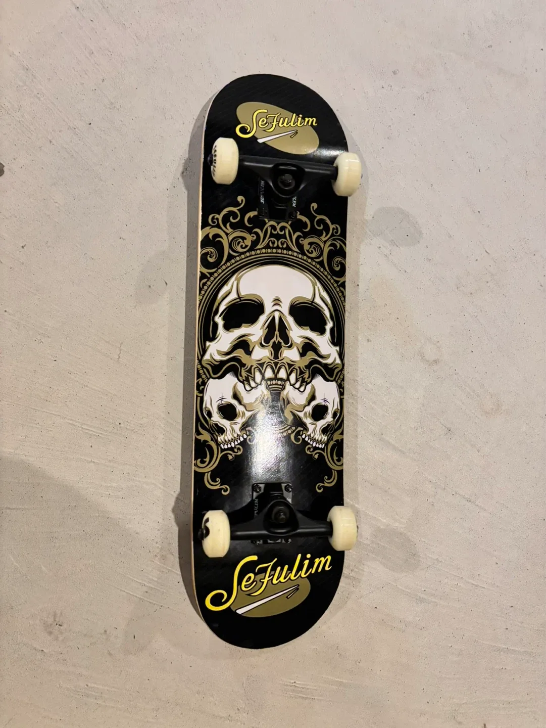 Sejulim Skateboard with Skull Graphic