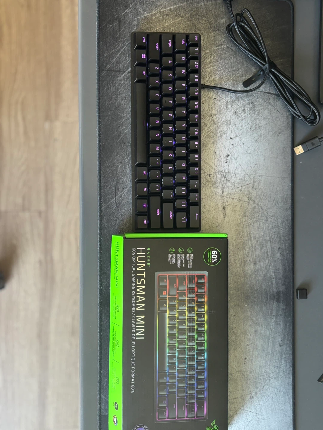 Razer Huntsman Mini 60% Gaming Keyboard with cables and box.
