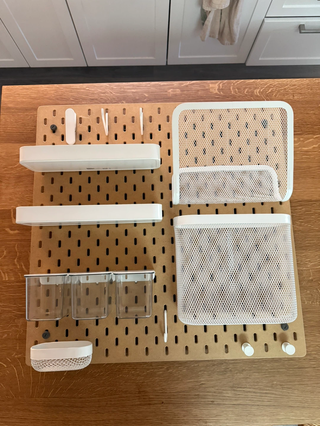White Pegboard Organizer with Baskets and Shelves