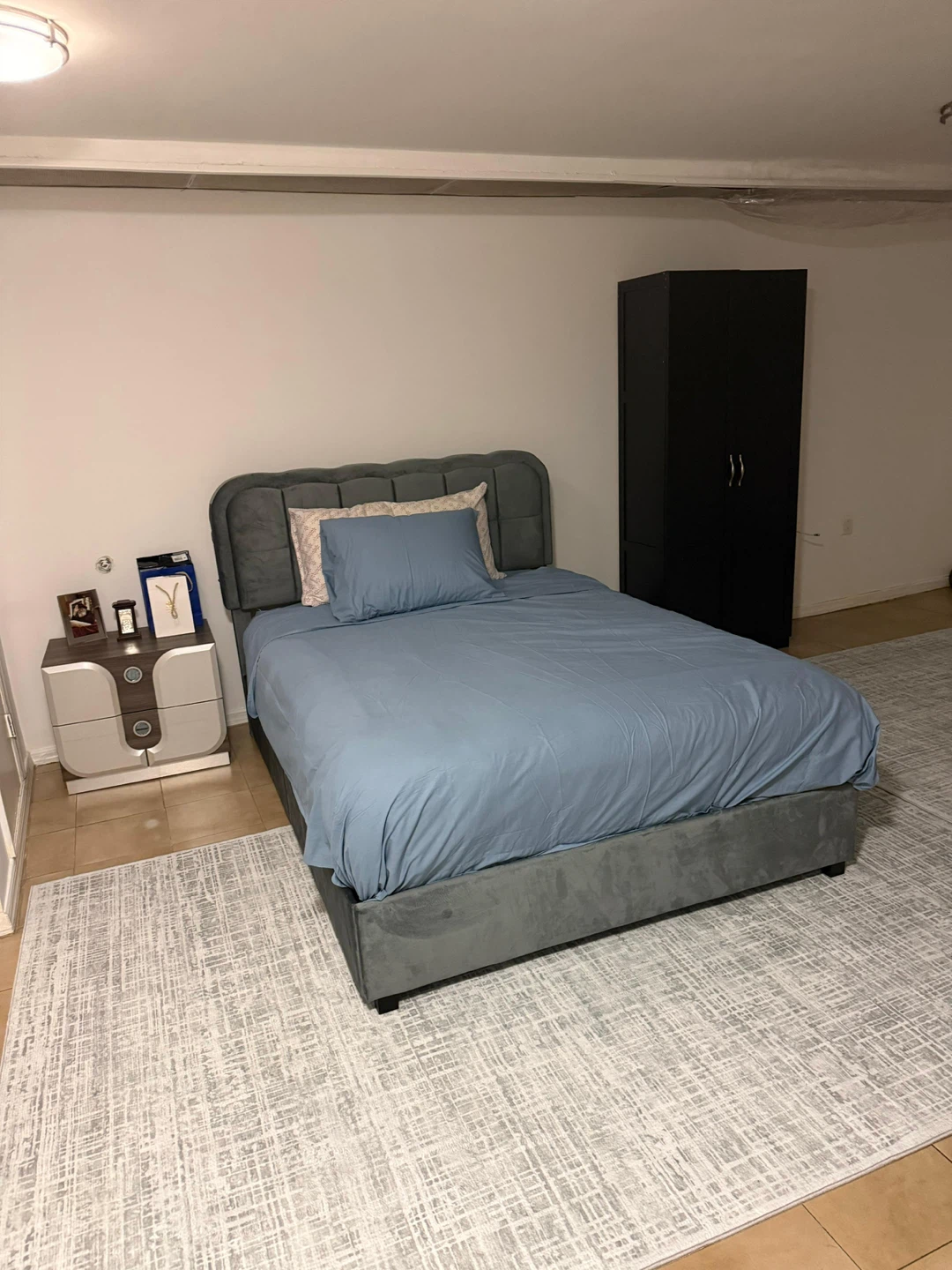 Grey Upholstered full size Bed Frame with a soft mattress