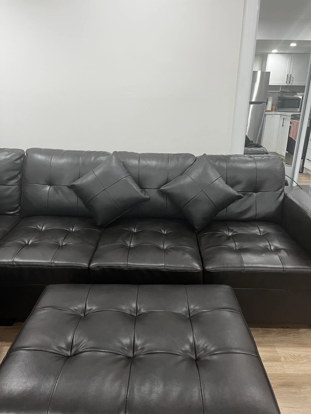 Black Leather Sectional Sofa with Storage Ottomans