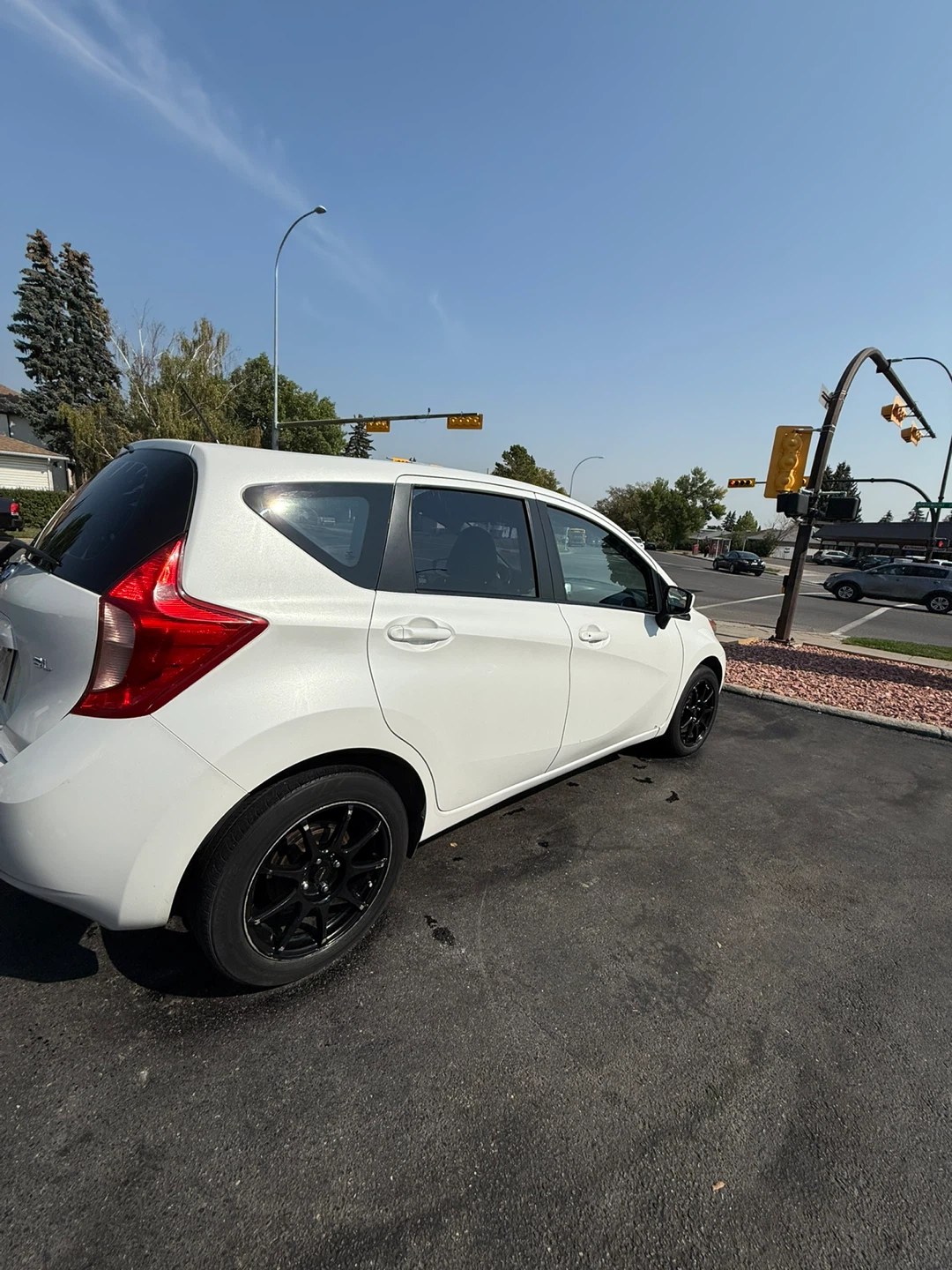 White Nissan Versa Hatchback - photo 3