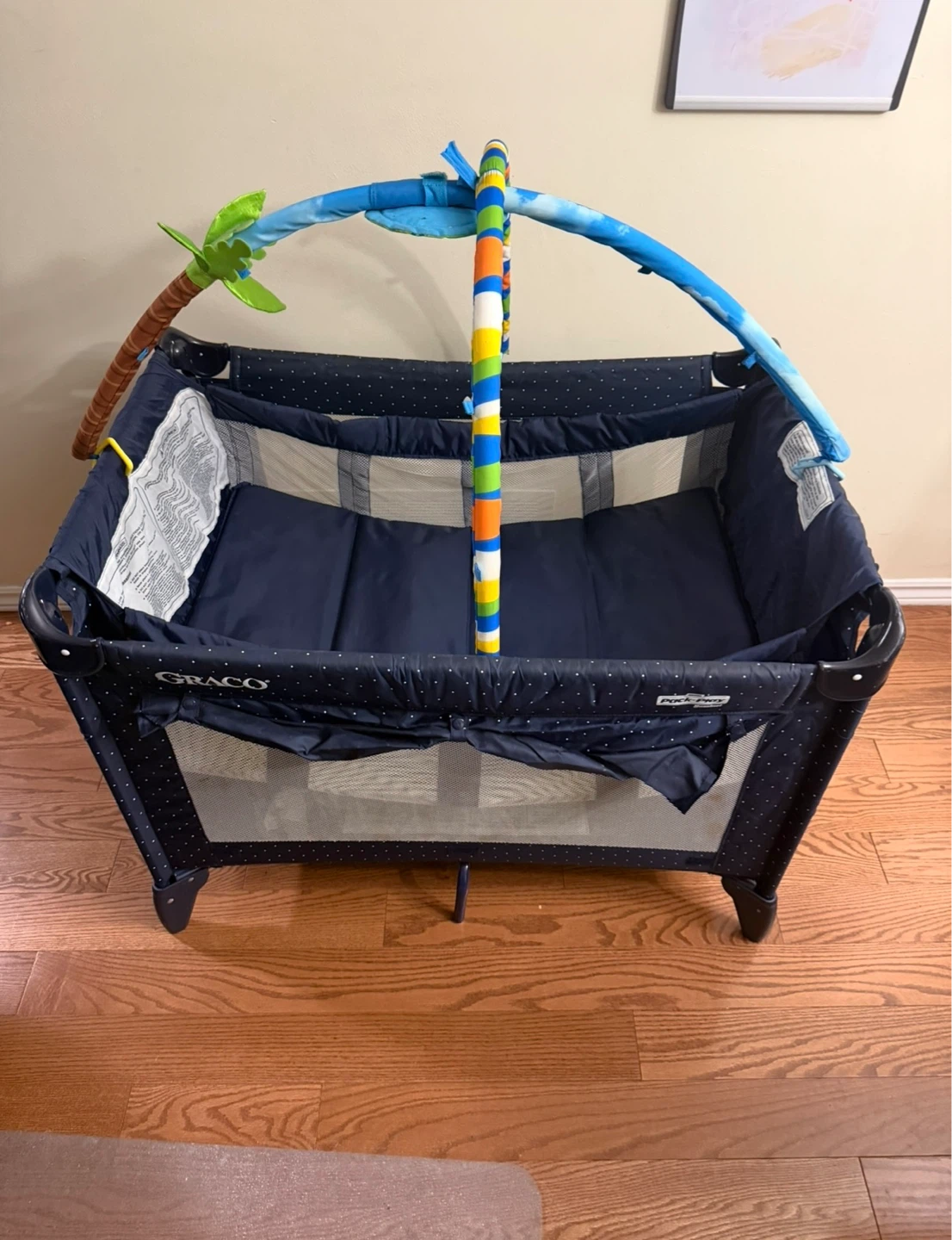 Play/Sleep Playard with Multi-level and Toy Bar