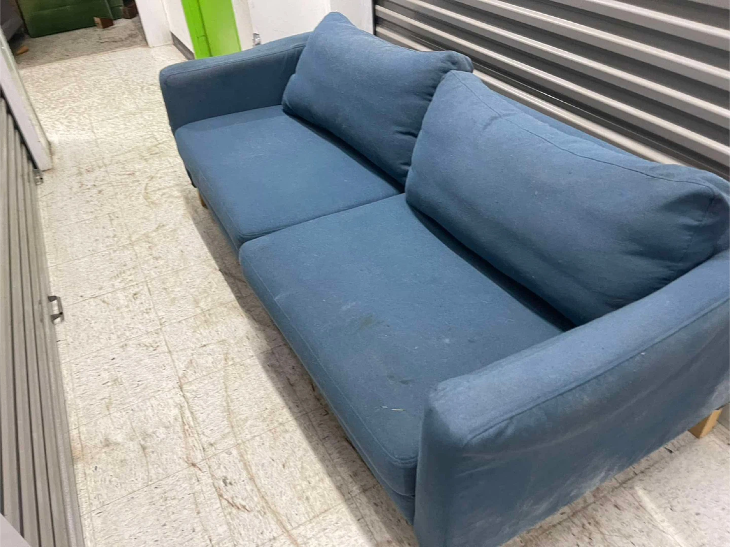 Blue two-seater sofa