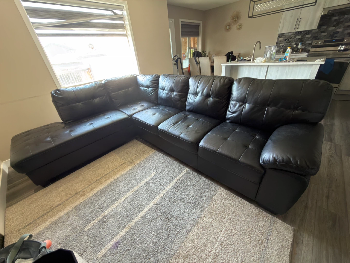 Sectional black leather sofa