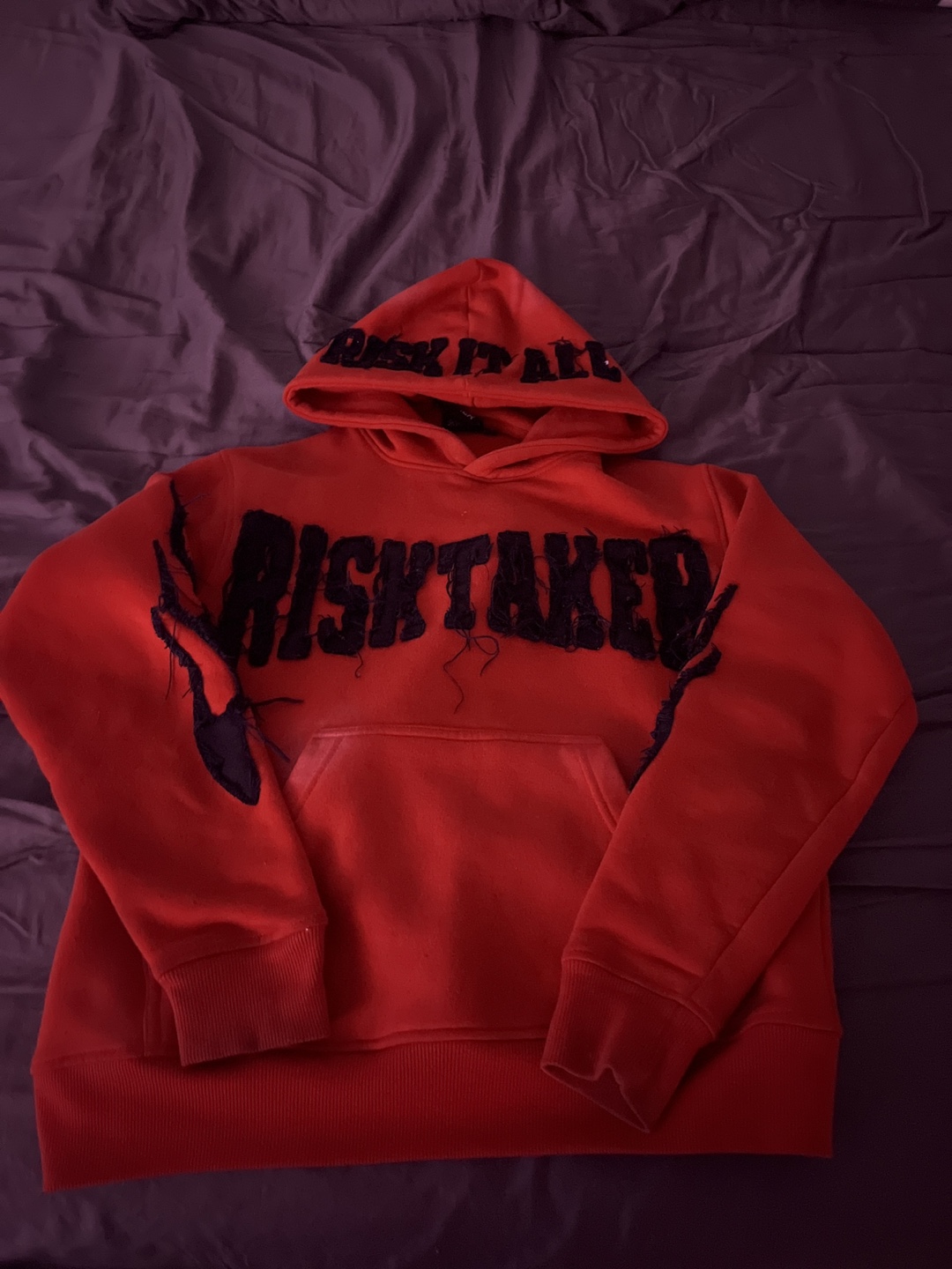 Red RISKTAKER Hoodie with "RISK IT ALL" on hood