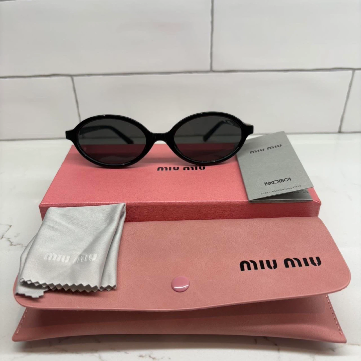 Miu Miu Black Oval Sunglasses