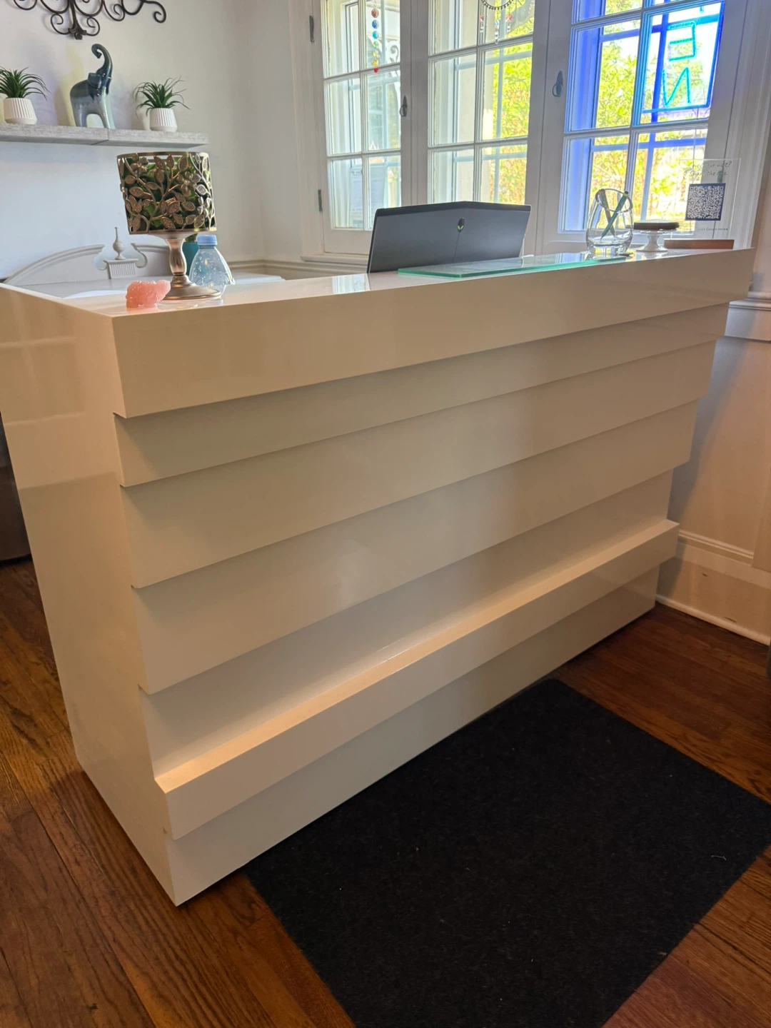 White reception desk with storage